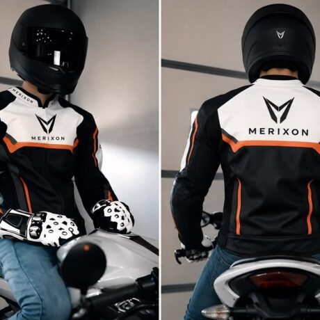 Black white orange motorcycle jacket worn by rider - supplied product visual