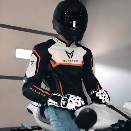 Motorbike apparel model wearing black white orange rider jacket - supplied product visual